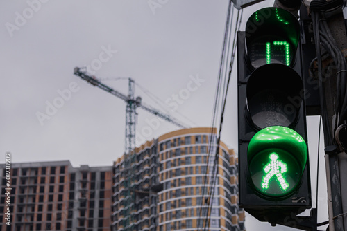 Kyiv, Ukraine - January 2, 2024: Beautiful and diverse buildings in Podil. Small old and already new high-rise buildings. Trams are still running photo