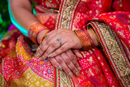 Indian bride's hands bangles and mehndi close up © Stella Kou