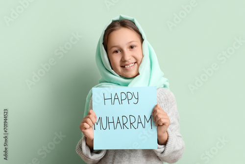 Little Muslim girl with gre...