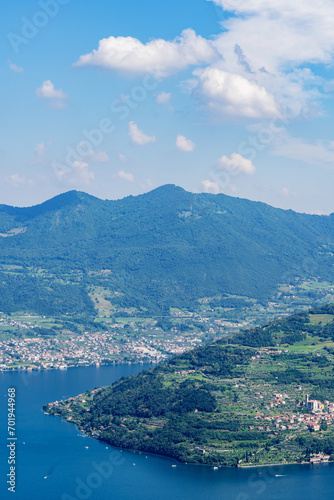 Mountain landscape, picturesque mountain lake in the summer morning, large panorama, landscape with fabulous lake view from the top of the mountain, with view of city. Iseo, Italy © photo-lime