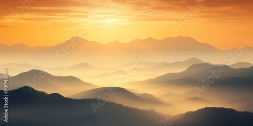 Majestic sunrise unveils a tranquil cloudscape over fog-kissed mountains, creating a scenic dawn panorama.