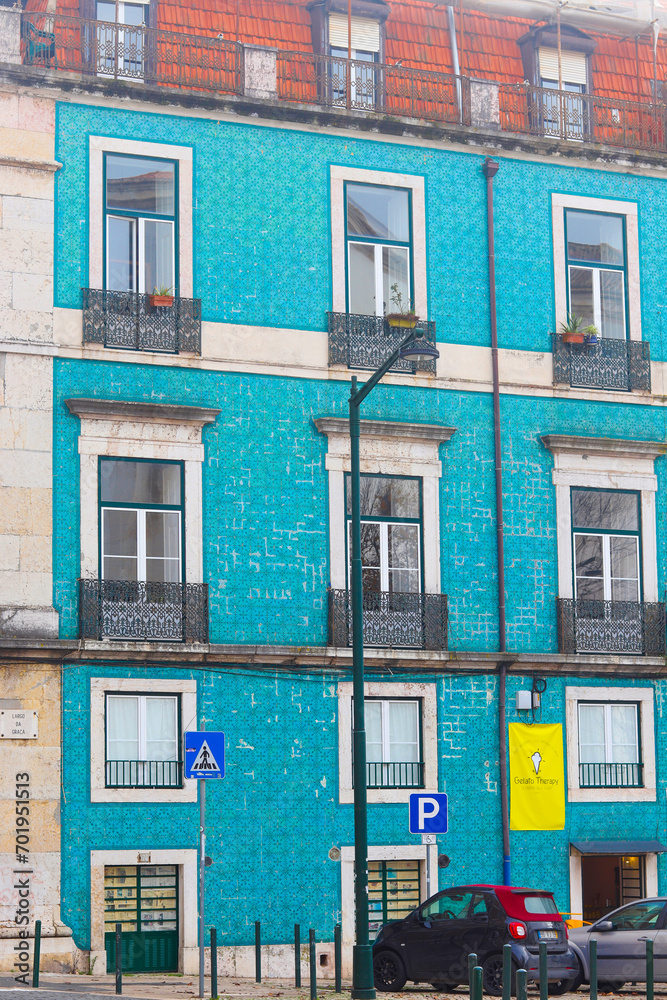 Lisbon, Portugal - December 11, 2023: Old colorful and beautiful facades. The building in blue color is tiled with carved balconies. Villa Sousa.