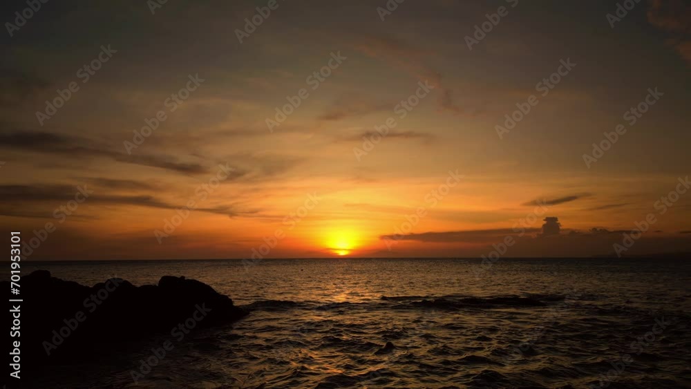 Sun is reflected in the sparkling sea, sunrise, Asia, Vietnam. Dramatic sea sunrise. Beautiful cloudscape over the sea, sunset time lapse shot. Burning sky and shining golden waves. 4K Sun is reflected in the sparkling sea, sunrise, Asia, Vietnam. Dramatic sea sunrise. Beautiful cloudscape over the sea, sunset time lapse shot. Burning sky and shining golden waves. 4K