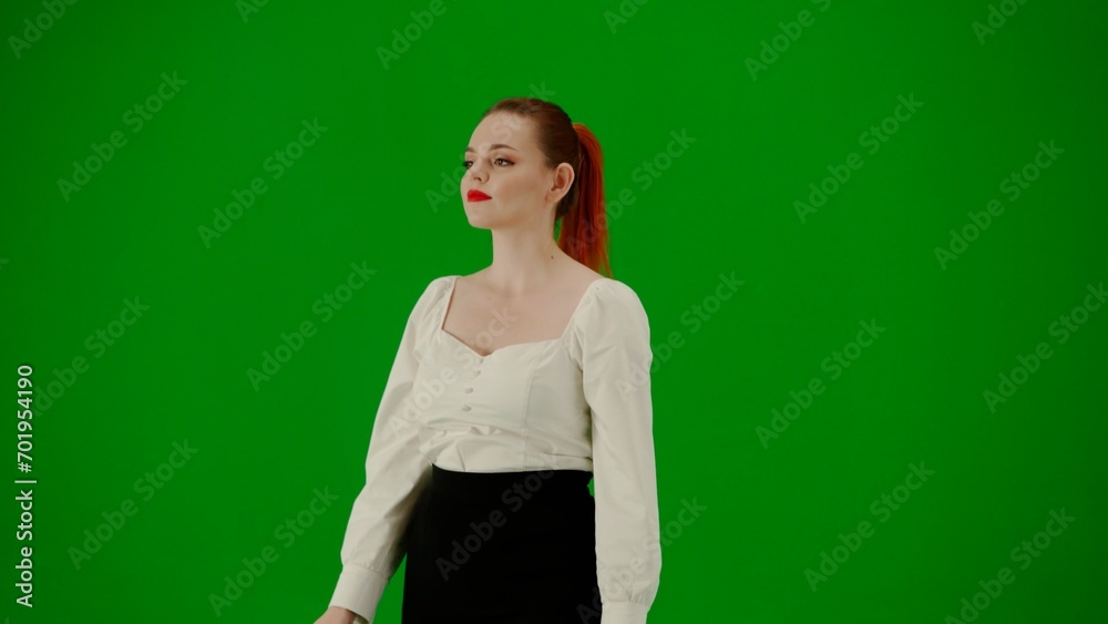 Portrait of attractive office girl on chroma key green screen. Woman in skirt and blouse walking cutely. Half turn. Portrait of attractive office girl on chroma key green screen. Woman in skirt and blouse walking cutely. Half turn.