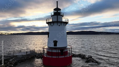 A lighthouse standing brilliant at sunset