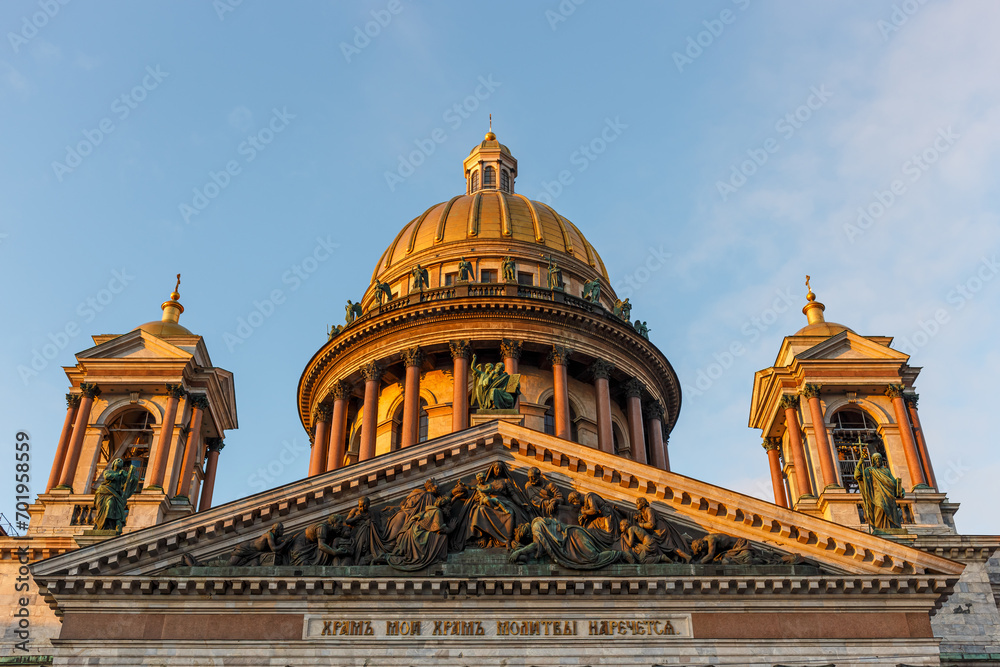 The golden dome of St. Isaac's Cathedral in St. Petersburg against the blue sky. The golden dome of St. Isaac's Cathedral in St. Petersburg against the blue sky.