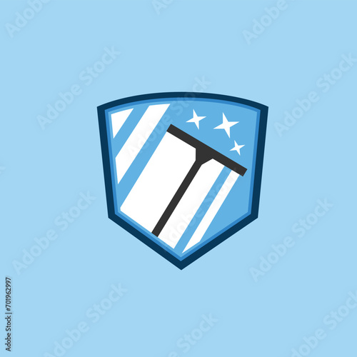 a squeegee cleaning a window in a shield logo