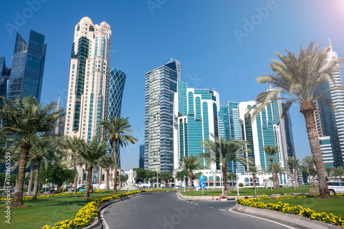 Al Dafna Park, Doha, West Bay, Qatar - View of Doha skyscrapers with palms photo