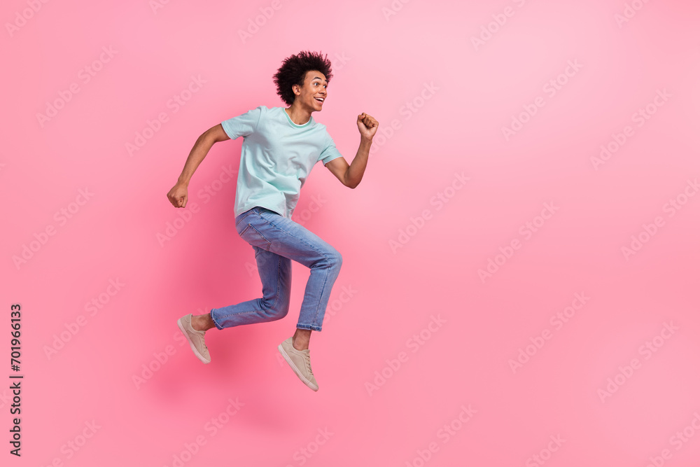 Full size photo of nice young guy running fast shopping sales dressed stylish blue outfit isolated on pink color background