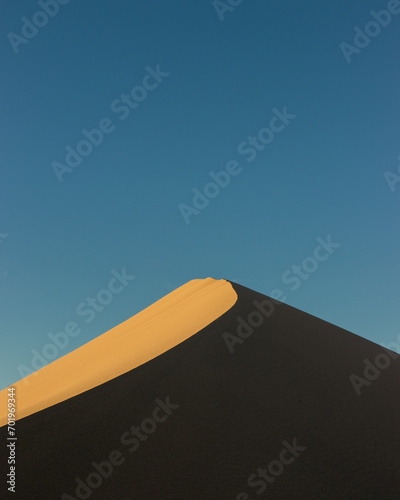 landscape of golden sand dune at sunset in Death Valley  California