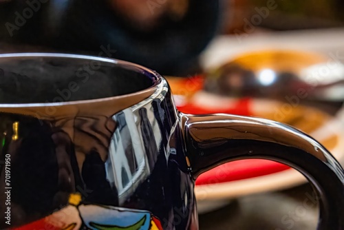 Cup with hot mulled wine, close-up