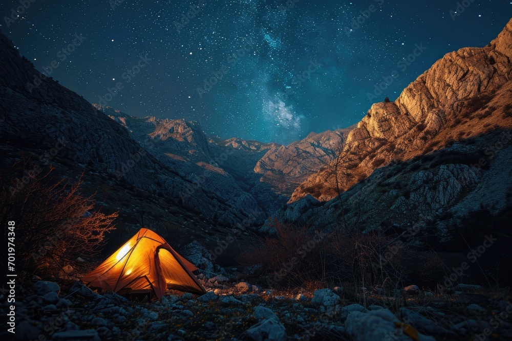 Wilderness Cosmos: In the Albanian wilderness, a trekker's campsite is illuminated by the clear night sky and twinkling stars, captured with high aperture and long exposure for a stunning night landsc