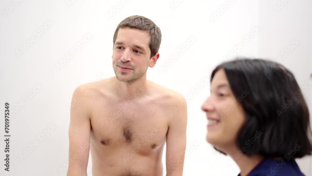 Video of a Happy patient talking to a cardiologist in a clinic while analyzing the results of a test Video of a Happy patient talking to a cardiologist in a clinic while analyzing the results of a test