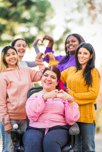 Inspire Inclusion international womens day. Diverse group do heart love with hands. Disability 