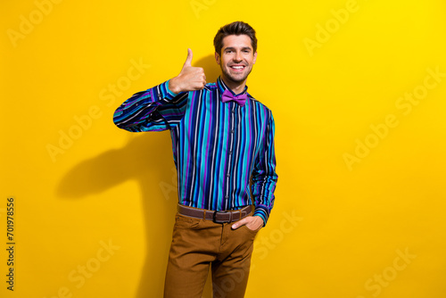 Bild auf Leinwand Portrait of satisfied nice guy dressed stylish shirt bow tie show thumb up good
