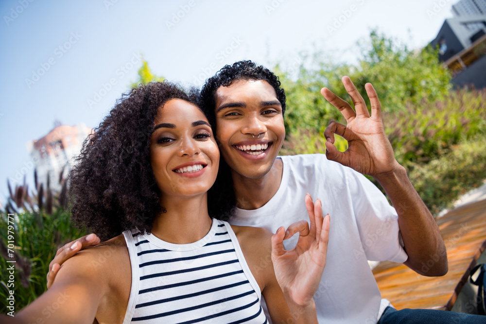 Photo of attractive cheerful black skin boyfriend girlfriend on honeymoon vacation recommend travel trip show okey sign summer outdoors Photo of attractive cheerful black skin boyfriend girlfriend on honeymoon vacation recommend travel trip show okey sign summer outdoors