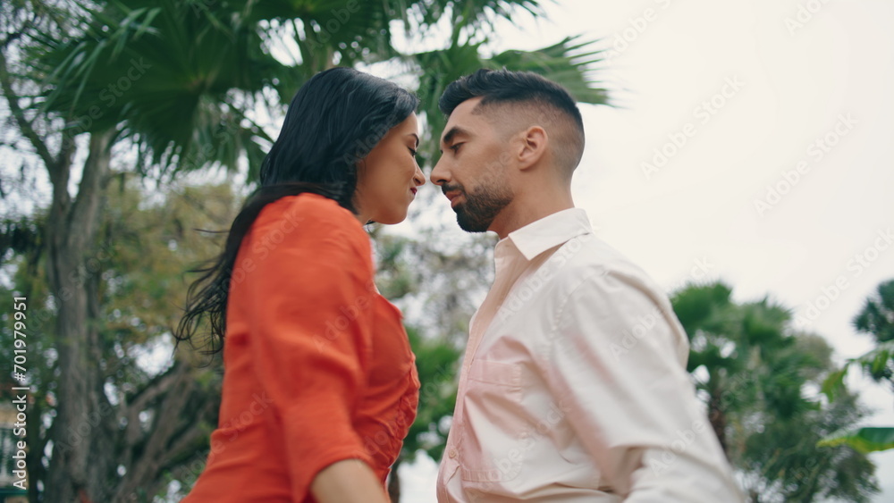 Artists dancing latin american style choreography in beautiful garden close up. Artists dancing latin american style choreography in beautiful garden close up.