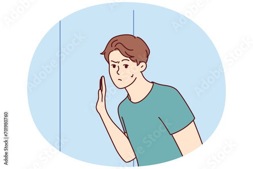Embarrassed man leaned against door wanting to eavesdrop on someone else secret or hear conversations of people behind wall. Thoughtful guy in t-shirt spying on neighbors. Flat vector image