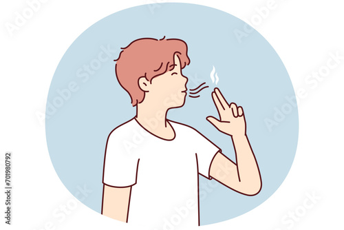 Casual guy teenager puts fingers to lips depicting gun wants to seem like smoker. Youth man lights invisible cigarette suffering from bad habits or nicotine addiction. Flat vector illustration