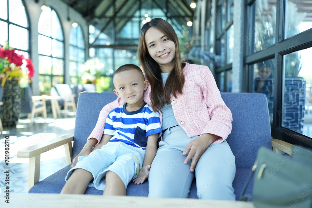 Mother and child are happy touring the cafe