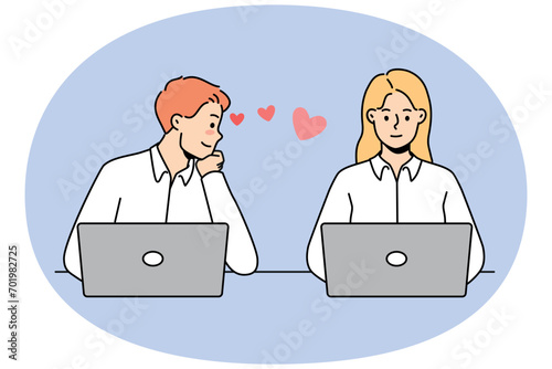 Young man in love look at female colleague working together at laptops in office. Male employee admire woman worker at workplace. Work romance. Vector illustration.