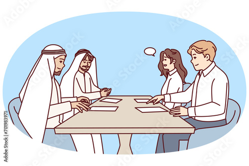 Managers of international company sit at table with papers and discuss investments. Business talks of people in Arabian clothes and European company employees with speech bubble. Flat vector image
