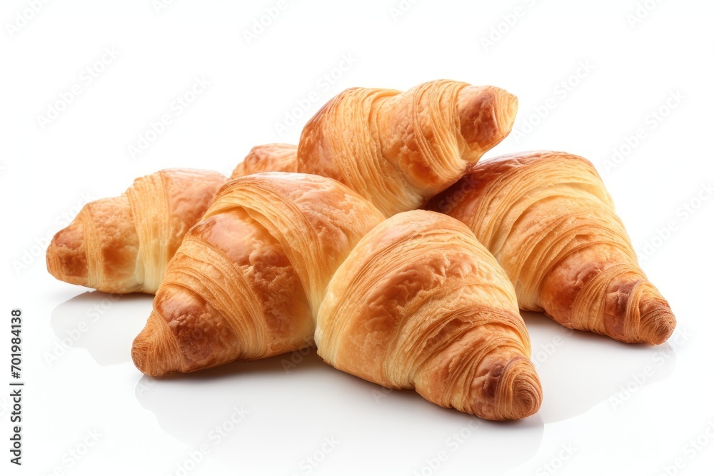 Fresh croissants displayed on a plain white background