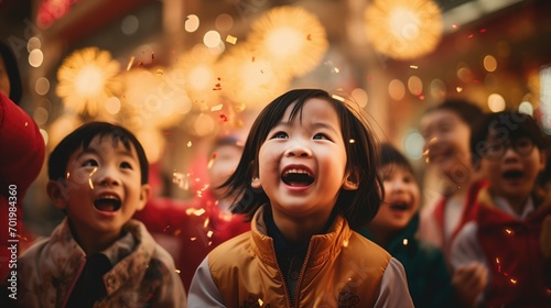 Excited children watch fireworks during a Lunar New Year celebration