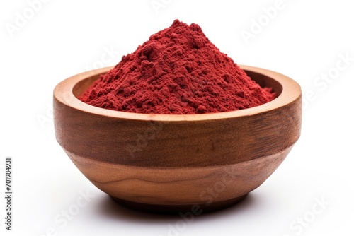 Isolated white background with sumac powder in wood plate Heap of sumac powder isolated