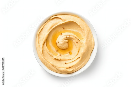 Top view of isolated tasty hummus on white smudged photo