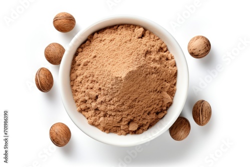 Top view of nutmeg powder against a white background