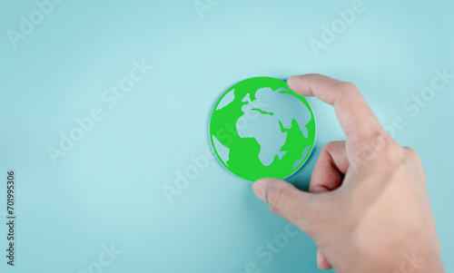 Hand Saving energy and protection green world Renewable energy, Reducing carbon or CO2 in the atmosphere for sustainable air and green energy.