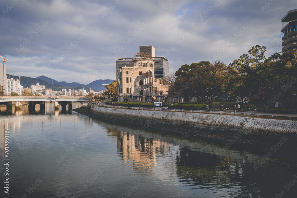 View of the Atomic Bomb Dome and the river flowing nearby in Japan.