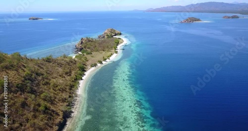 Aerial View of Nunsa Tiga, an island in the 17 Island Marine Park in East Nusa Tenggara, Indonesia.  photo