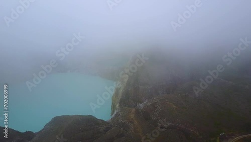 Early morning misty aerial view of the Kelimutu three colored lakes in East Nusa Tenggara, Indonesia. photo