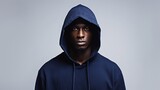 A black person wearing hoodie in navy blue color over white background