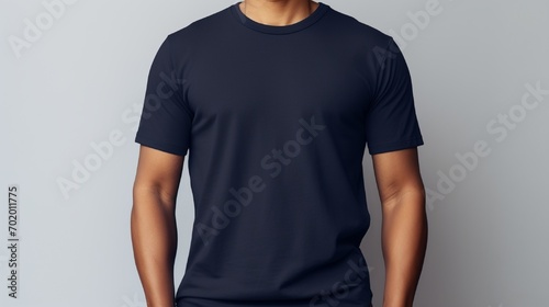A navy bluet shirt on person over creamy background photo