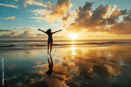 A radiant woman on the beach at sunrise, her joyful leap reflecting the fulfillment of her dreams and the start of a new chapter in her successful journey. photo