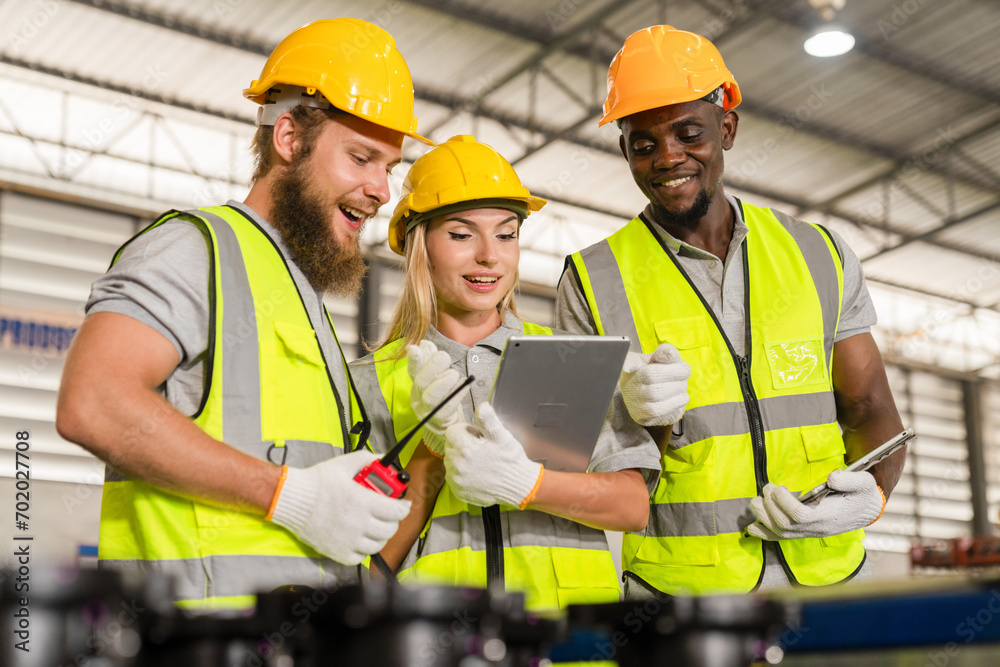 Female and African American male workers use tablets to work in warehouses, engineer teams shipping order detail export and import,industry,goods,factory,warehouse,international trade,transportation,