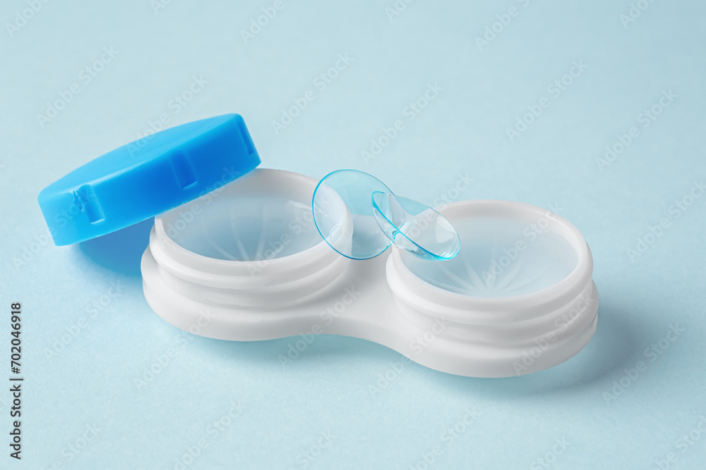 Contact lenses, closeup with case on light blue background Contact lenses, closeup with case on light blue background