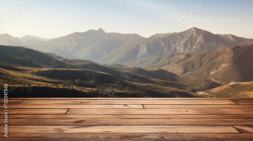 wooden table against mountain scenery hill blurry background
