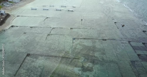 Aerial View of seaweed farming in Suana, on Nusa Penida Island, Bali, Indonesia.  photo