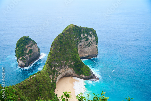 Cinematic aerial landscape shots of the beautiful island dinosaur of Nusa Penida. Huge cliffs by the shoreline and hidden dream beaches with clear water.