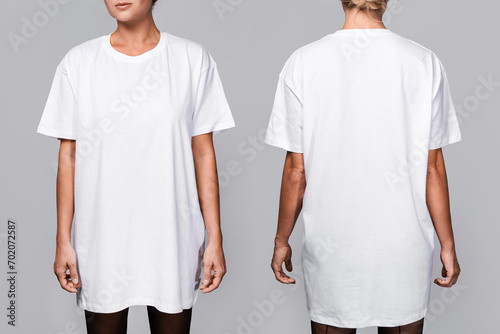 Front and back views of a woman wearing a white, oversized t-shirt with blank space, ideal for a mockup, set against gray background