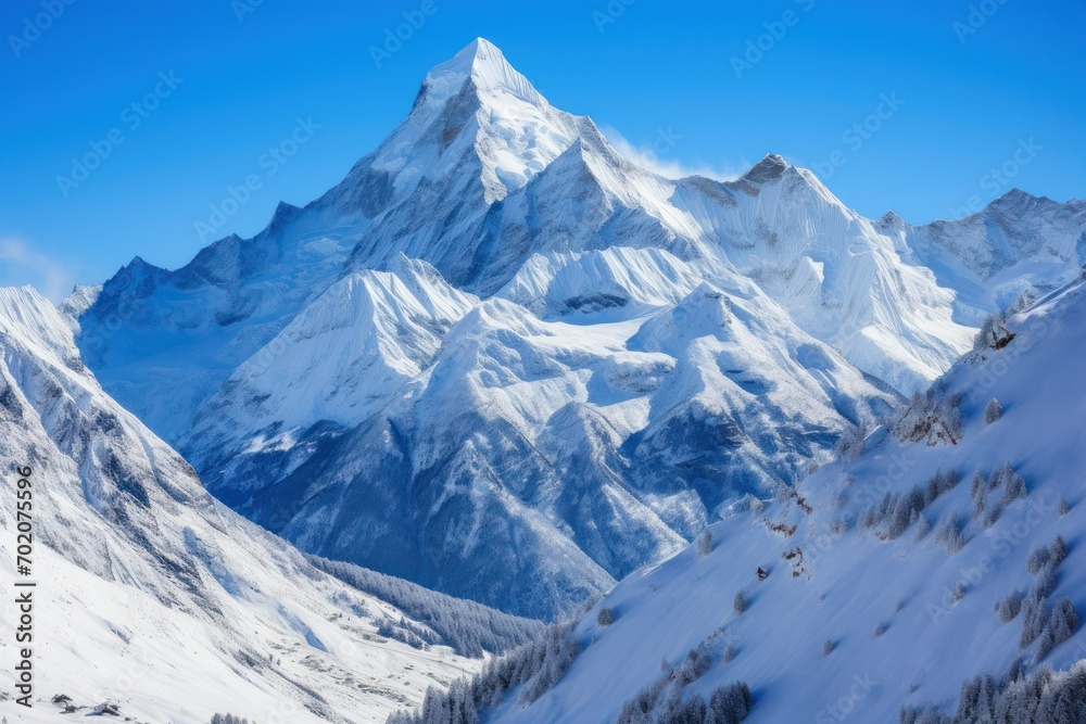 Obraz premium Capture the grandeur of snow-capped peaks against a clear blue sky