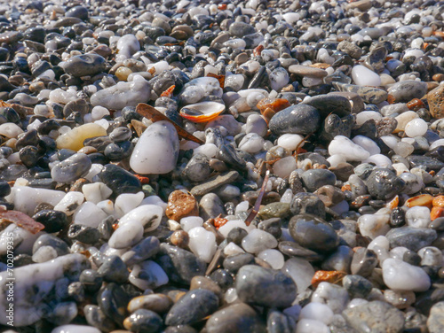 Background of colorful pebbles on the sand beach