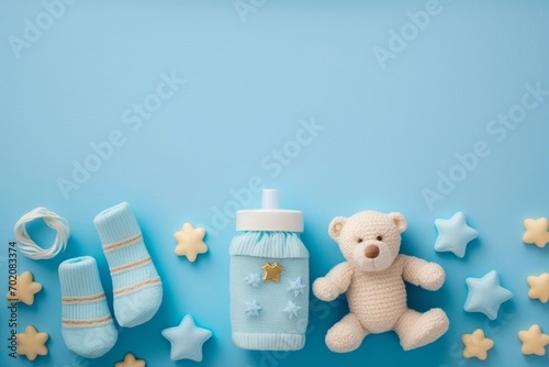 Baby accessories concept. Top view photo of giftbox knitted booties teddy-bear toy pacifier milk bottle and gold stars on isolated pastel blue background with, Generative AI photo