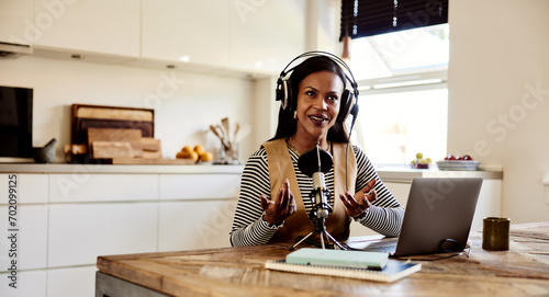 Woman talking during a home podcast photo