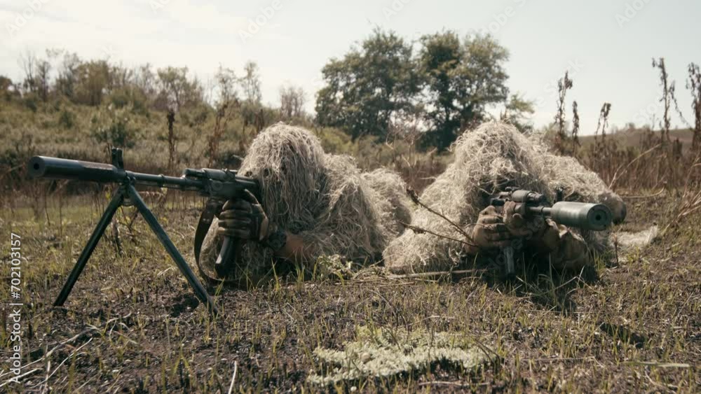 Vidéo Stock Snipers In An Ambush In The Grass Disguised As Terrain On