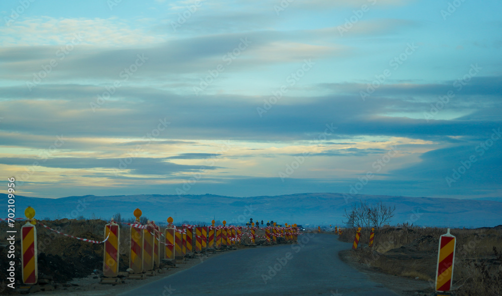 work in progress. the road being rehabilitated. detail. road markings for safety. work in progress. the road being rehabilitated. detail. road markings for safety.